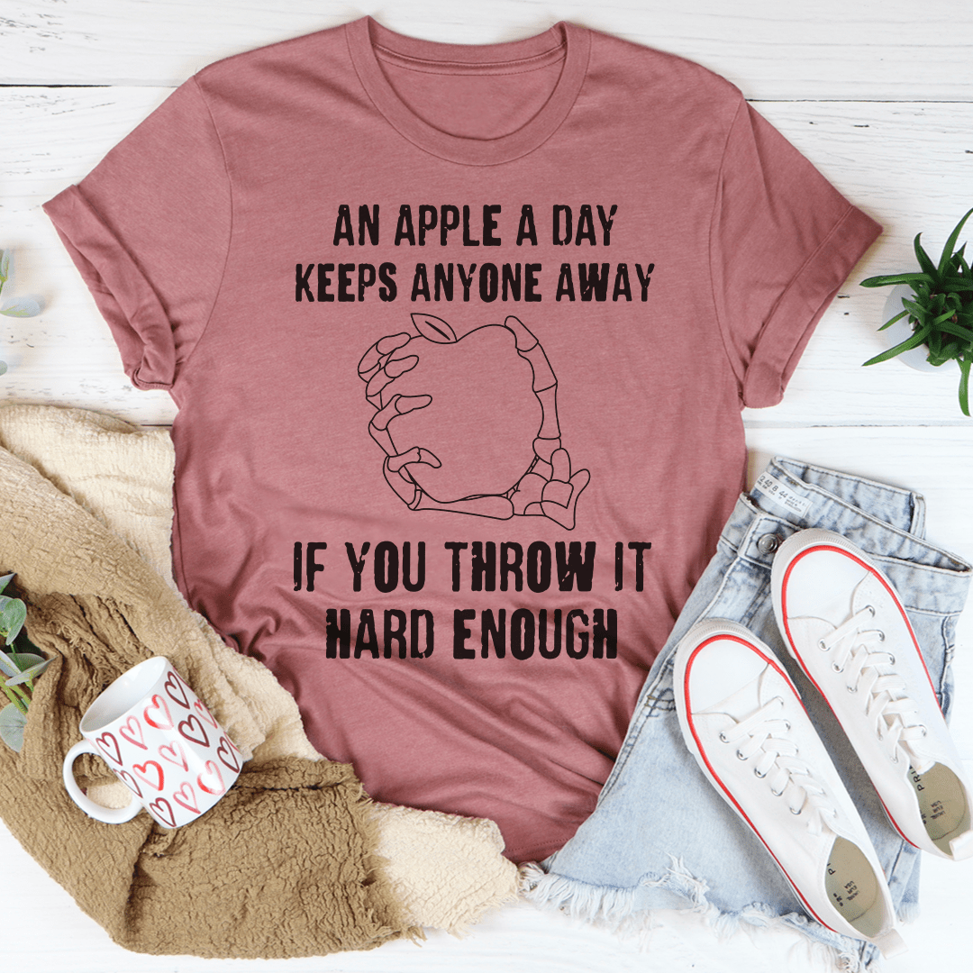 Mauve crew-neck T-shirt with apple graphic and slogan "Throw it hard enough"