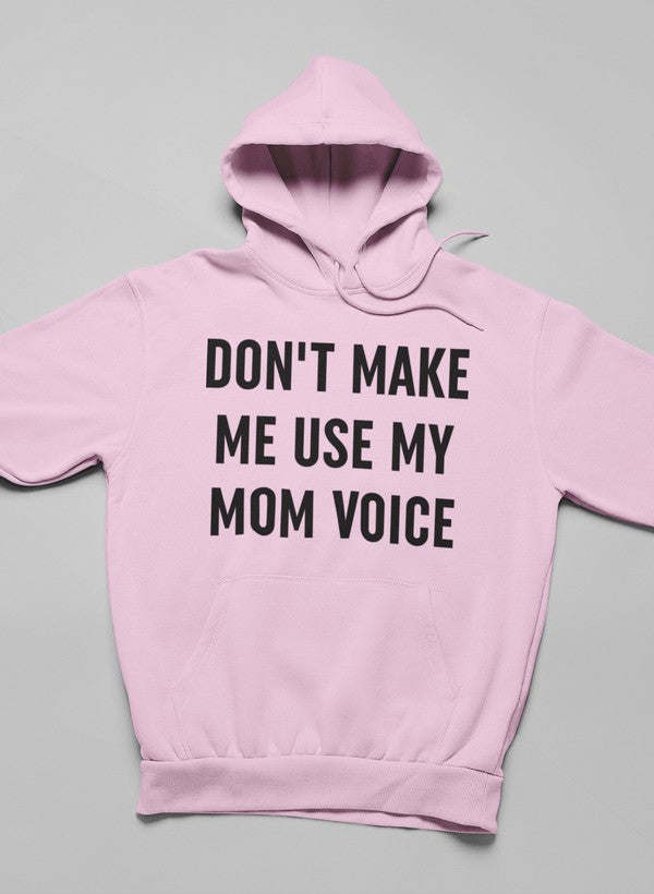 Soft pink hoodie with front 'Don't Make Me Use My Mom Voice' lettering