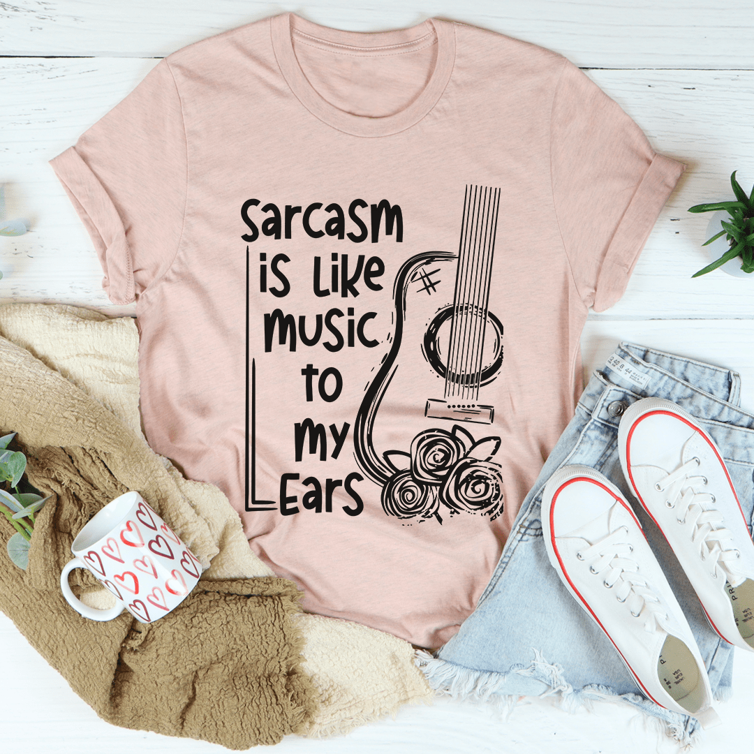 Light mauve crew-neck T-shirt with black music and ears graphic
