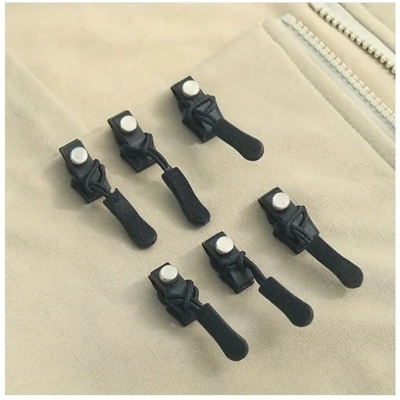 No sew zipper repair tools spaced on a light fabric zipper seam