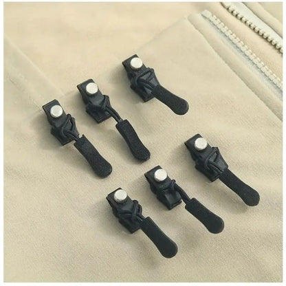 No sew zipper repair tools spaced on a light fabric zipper seam