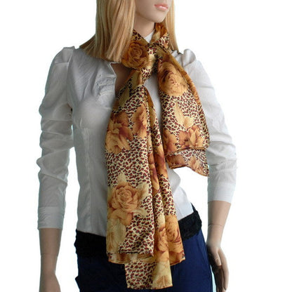 Silk scarf draped over neck, gold leopard print with rose floral accents