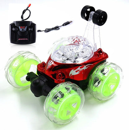 Mini RC stunt dump car with red body, translucent green wheels, and black remote controller