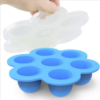 Blue silicone 7-cavity egg bite mold with clear lid