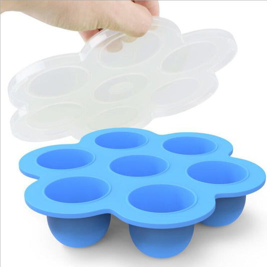 Blue silicone 7-cavity egg bite mold with clear lid