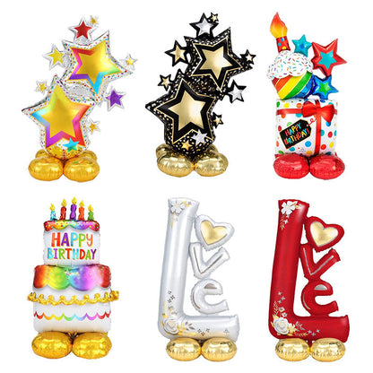 Assorted foil birthday balloons with stars, cake, and heart letter designs