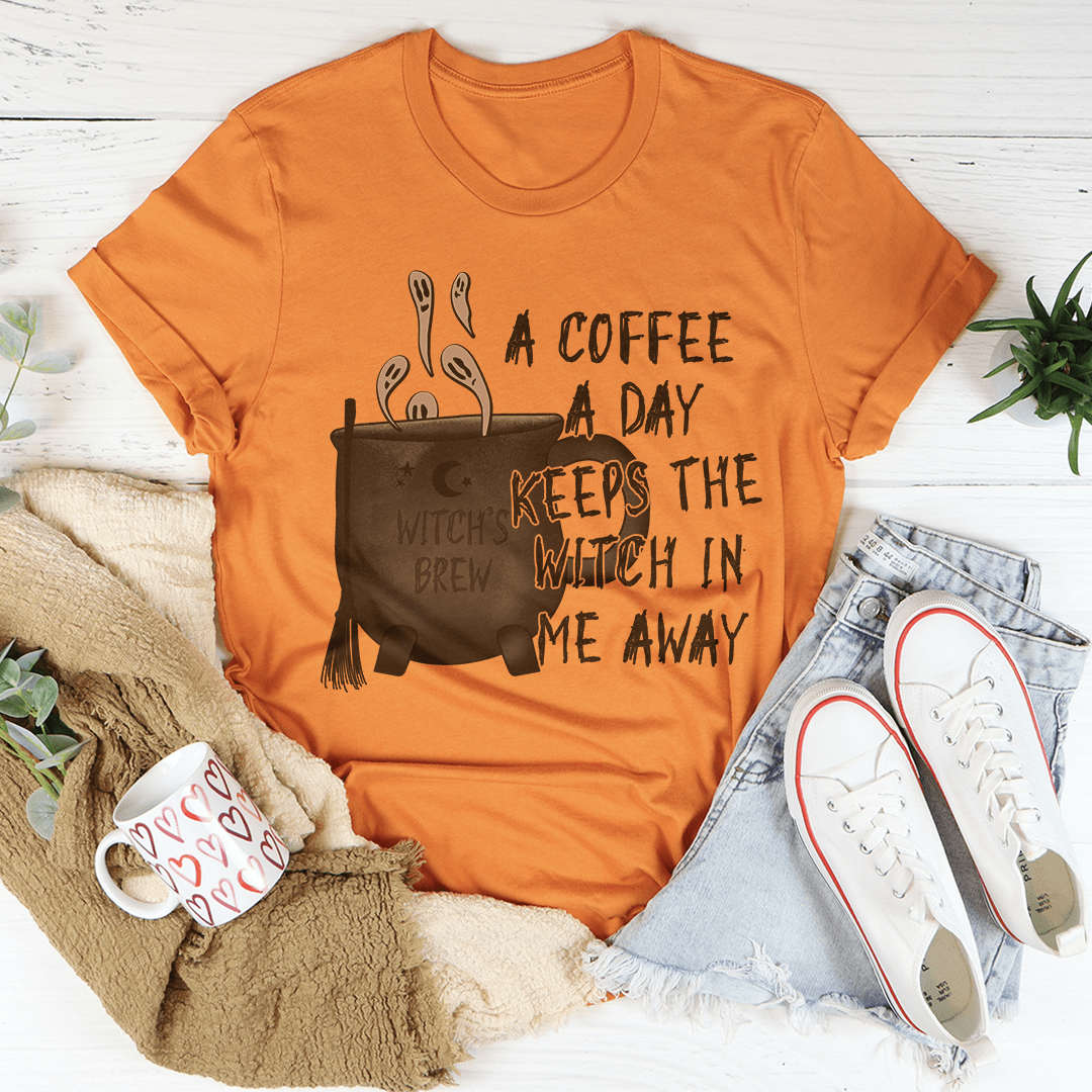 Burnt orange crewneck t-shirt with coffee pot and witch-themed front graphic