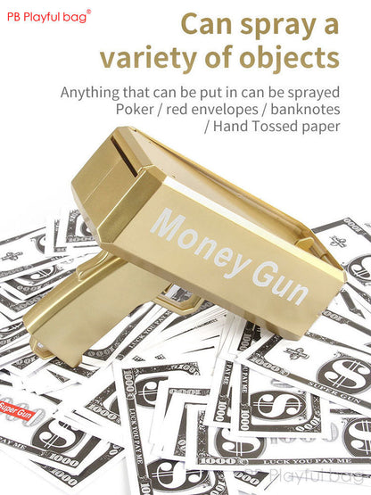 Gold money gun toy angled forward with prop cash bills underneath and tray open