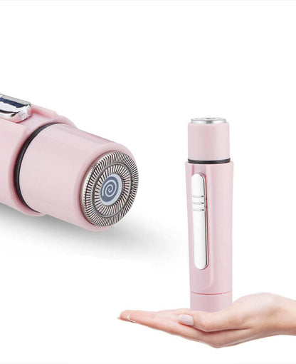 Pink grooming wand with rotating head and slender handle, shown in hand