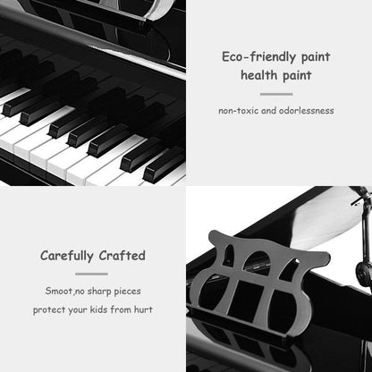 Black toy piano keyboard and music rack, showing glossy keys
