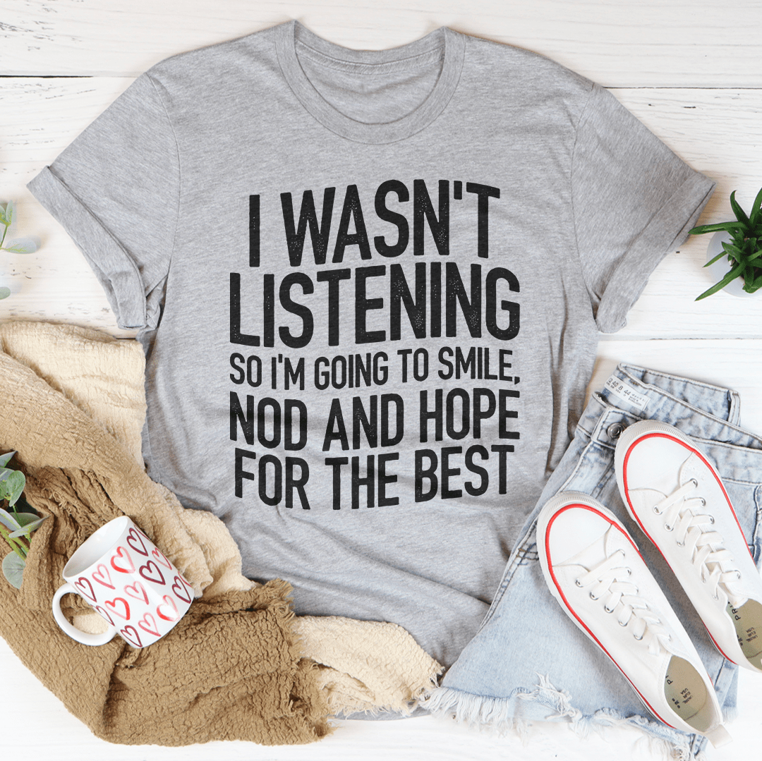 Gray graphic slogan T-shirt with bold "I WASN'T LISTENING" text