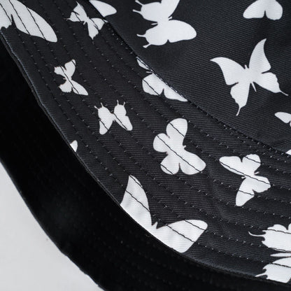 Black sun hat with white butterfly print and curved brim