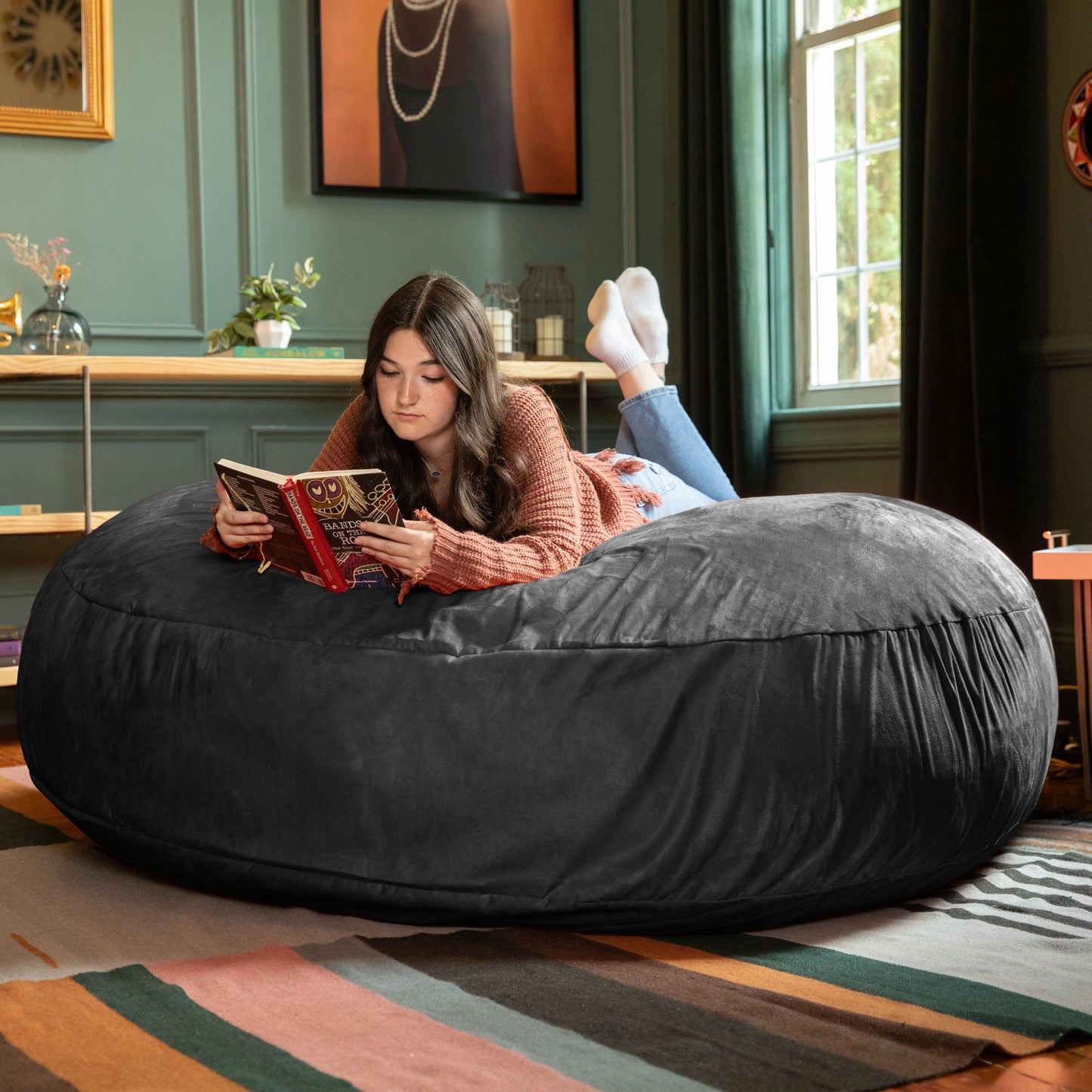 Black cocoon bean bag chair with microsuede cover, wide lounging seat