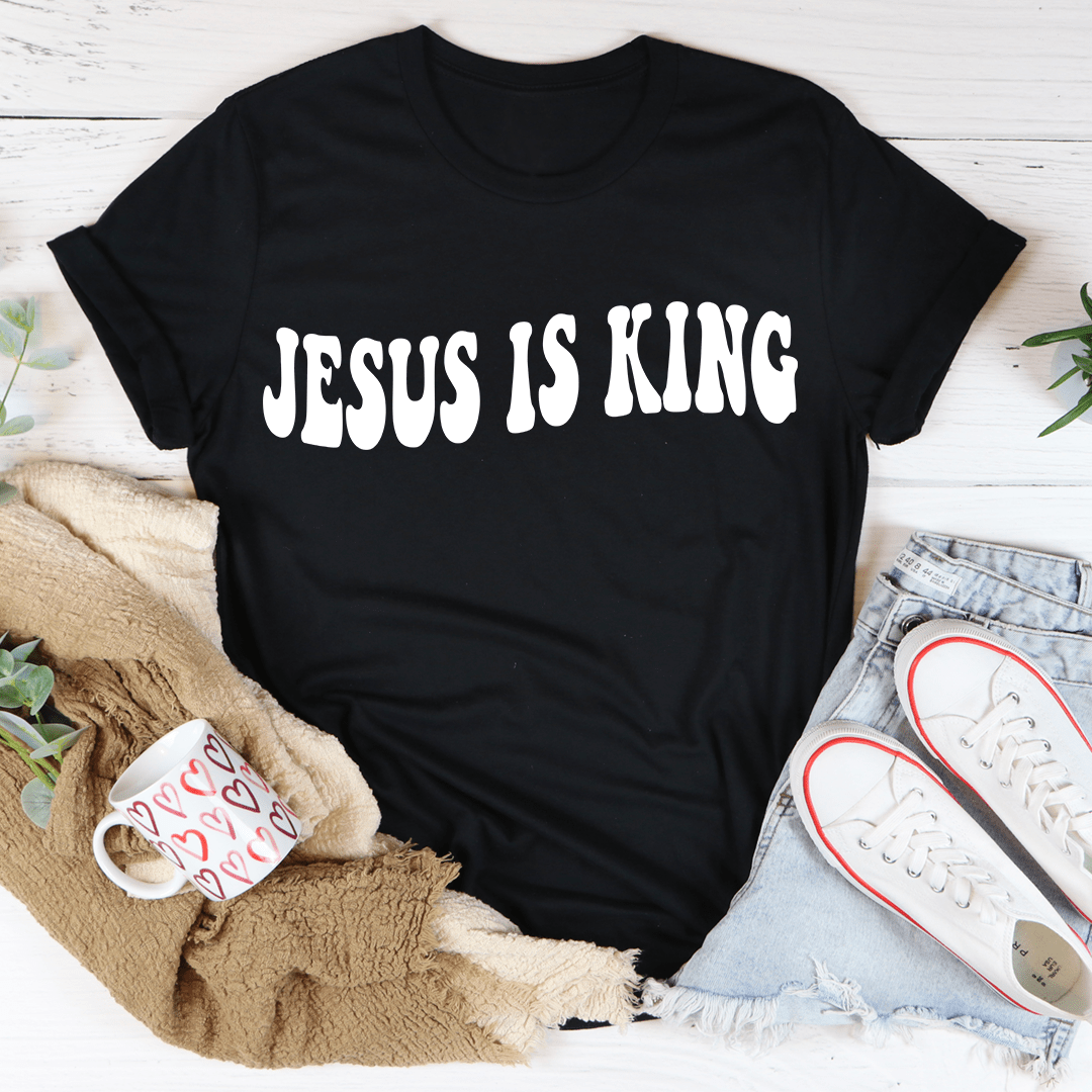 Black T-shirt with white "JESUS IS KING" distressed lettering on the front