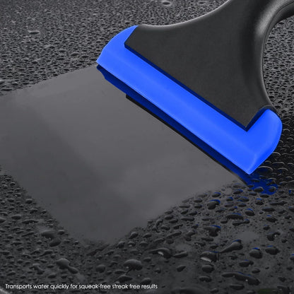Window squeegee with blue rubber edge scraping water on dark glass surface