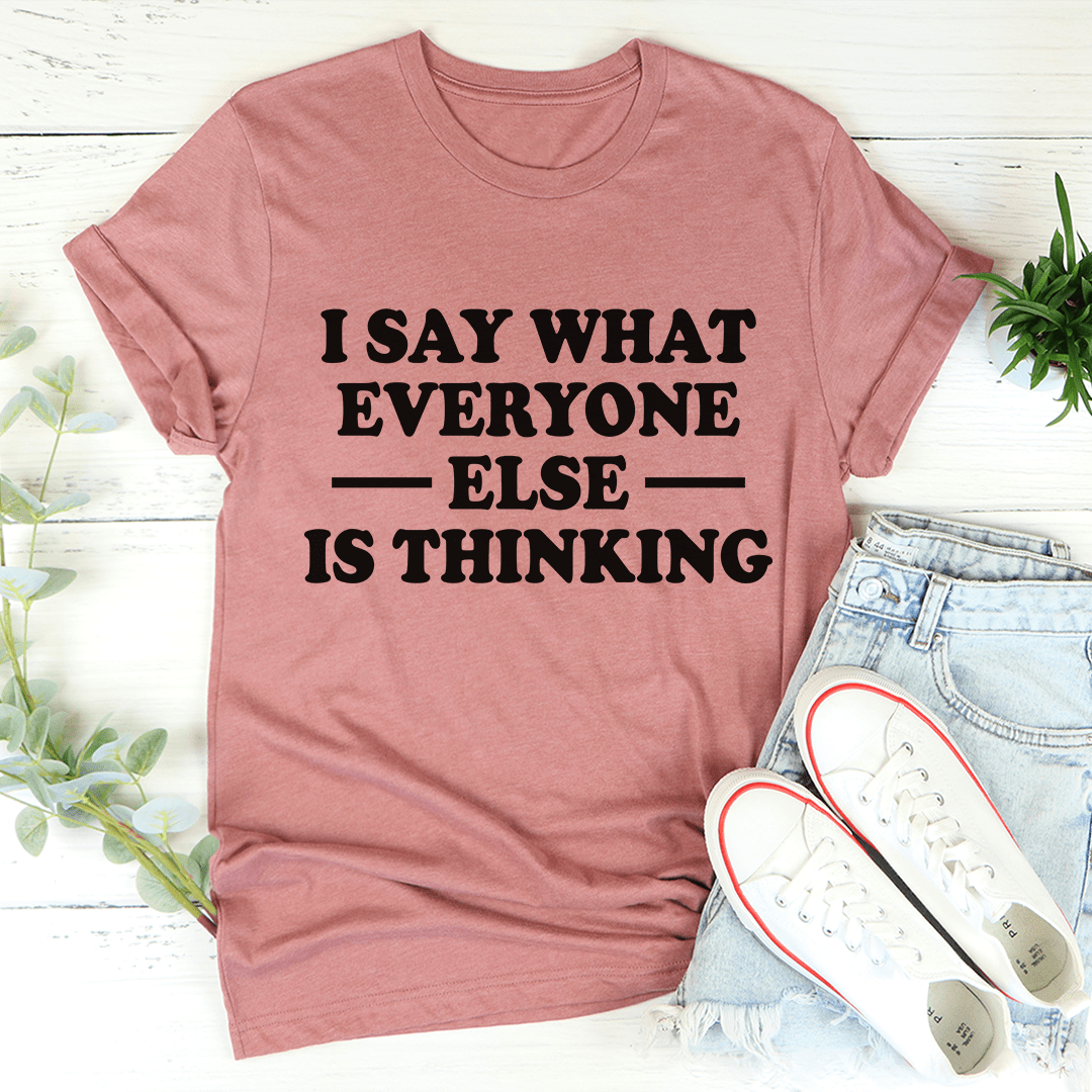 Mauve crewneck T-shirt with bold slogan text: I SAY WHAT EVERYONE ELSE IS THINKING