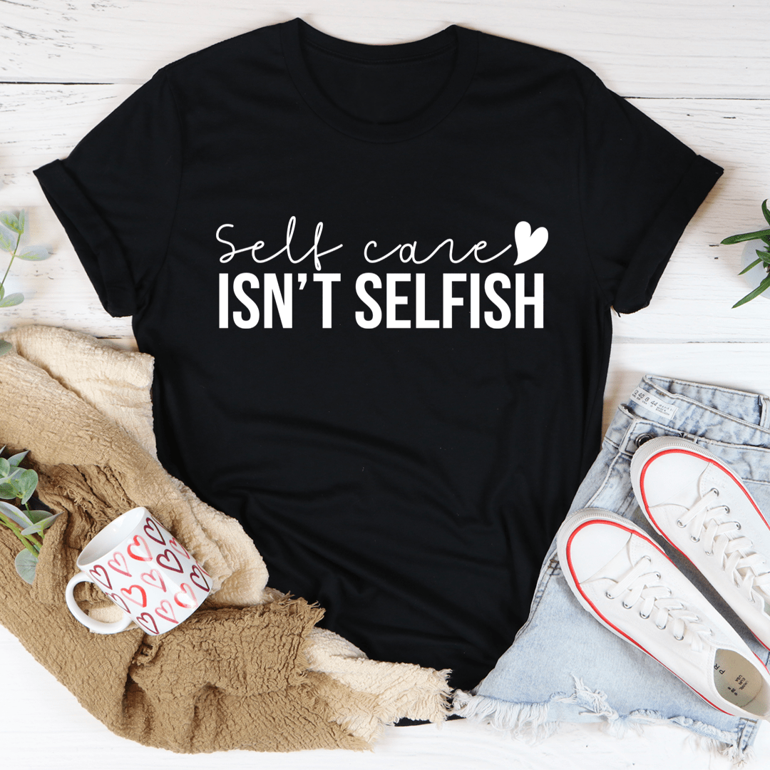 Black T-shirt with Self care isn't selfish graphic