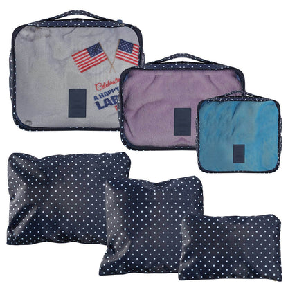 Travel packing cube set with navy polka dot, purple, and teal zippered pouches