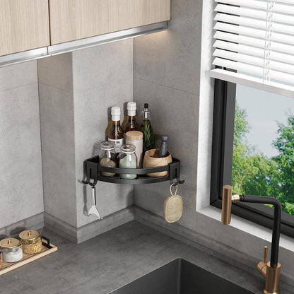 Black corner shower shelf caddy with two shelves, side hooks, and hanging sponge loop