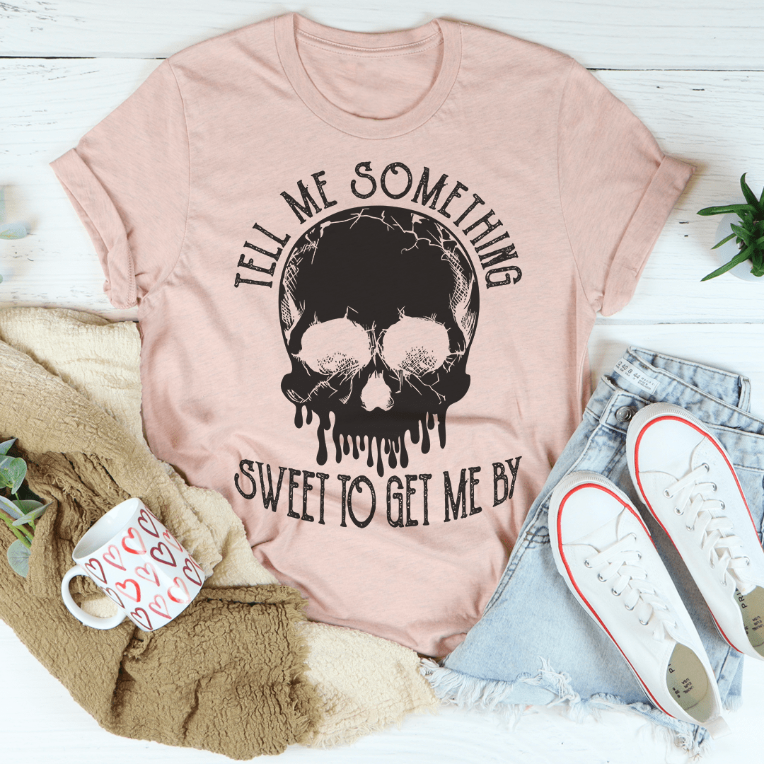 Dusty pink graphic T-shirt with skull head and 'SWEET TO GET ME BY' text