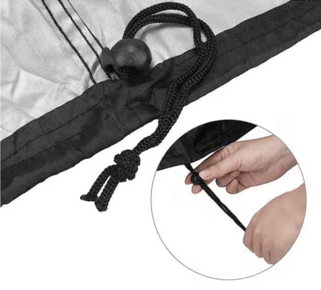 Black fire pit cover with drawstring and cord lock fastening at the edge