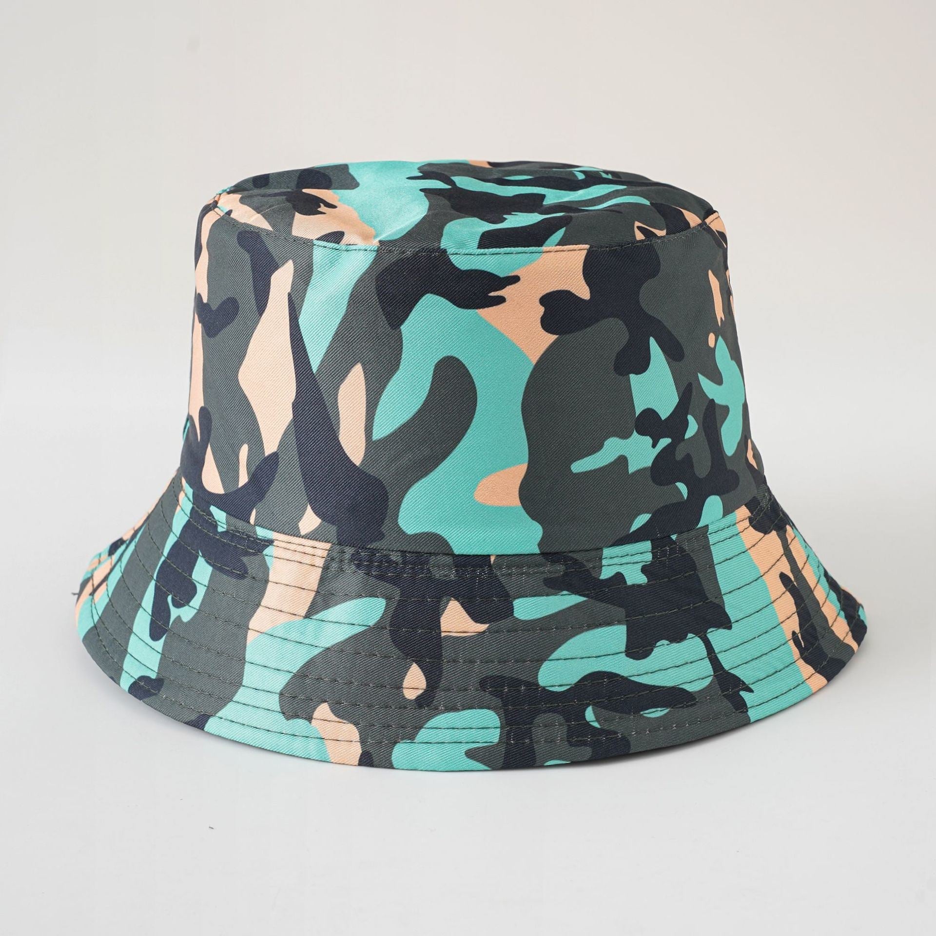 Double-sided fisherman hat, teal camouflage bucket with short brim and centered crown seam.
