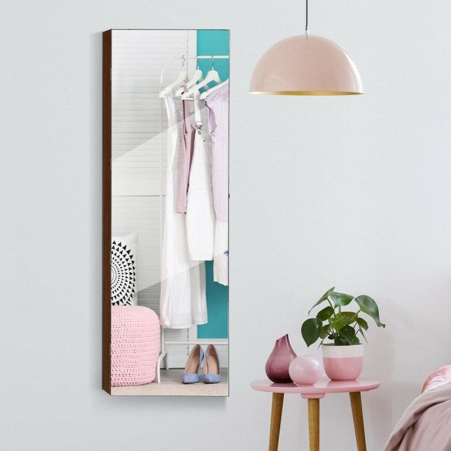 Brown framed mirrored jewelry cabinet with interior hanging storage