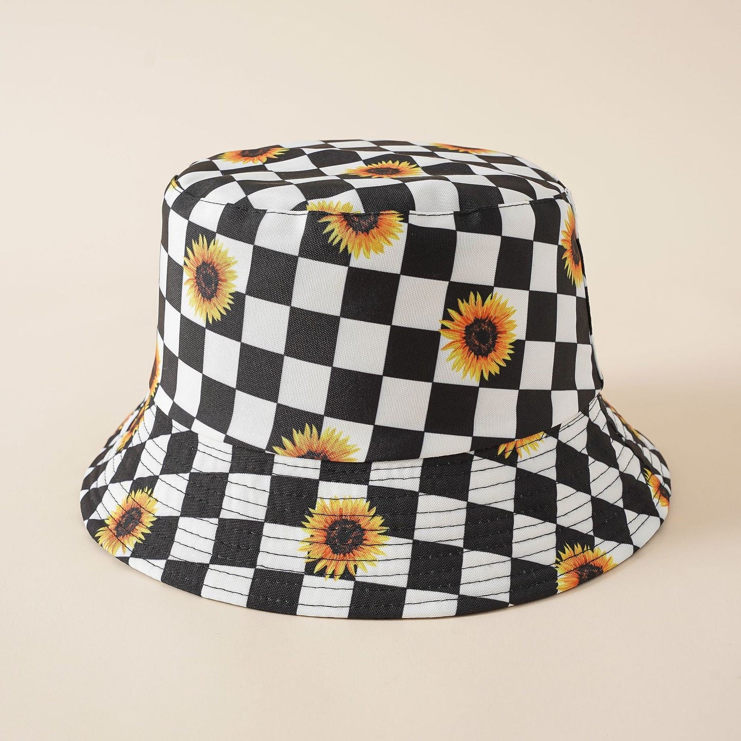 Double-sided fisherman hat with black-and-white check pattern and sunflower motifs