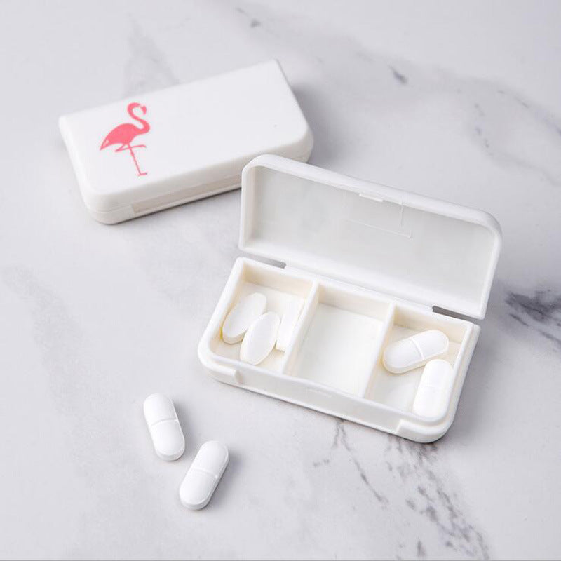 White 3-compartment portable pill organizer case, lid open with pill slots visible