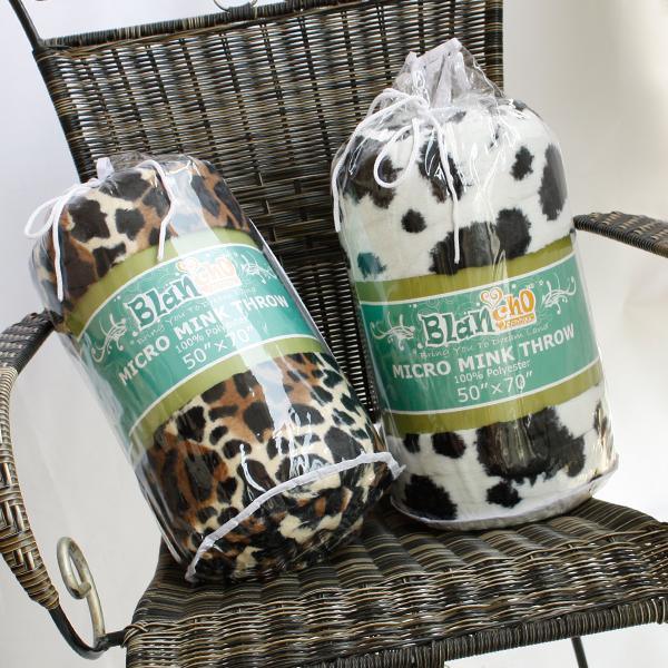 Dalmatian print micro mink throw blanket, rolled in package with green label