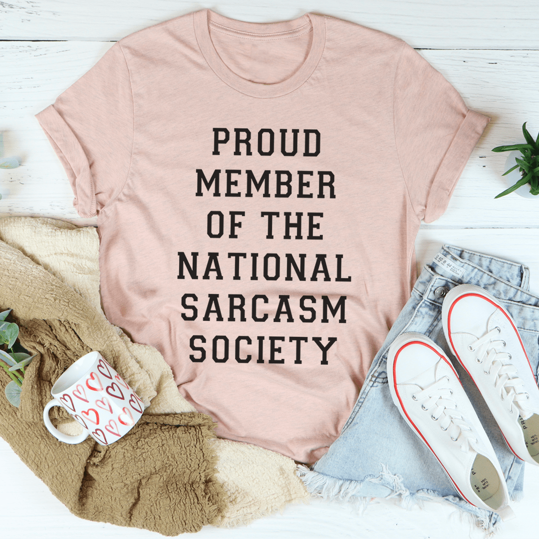 Heather peach T-shirt with black 'PROUD MEMBER OF THE NATIONAL SARCASM SOCIETY' print