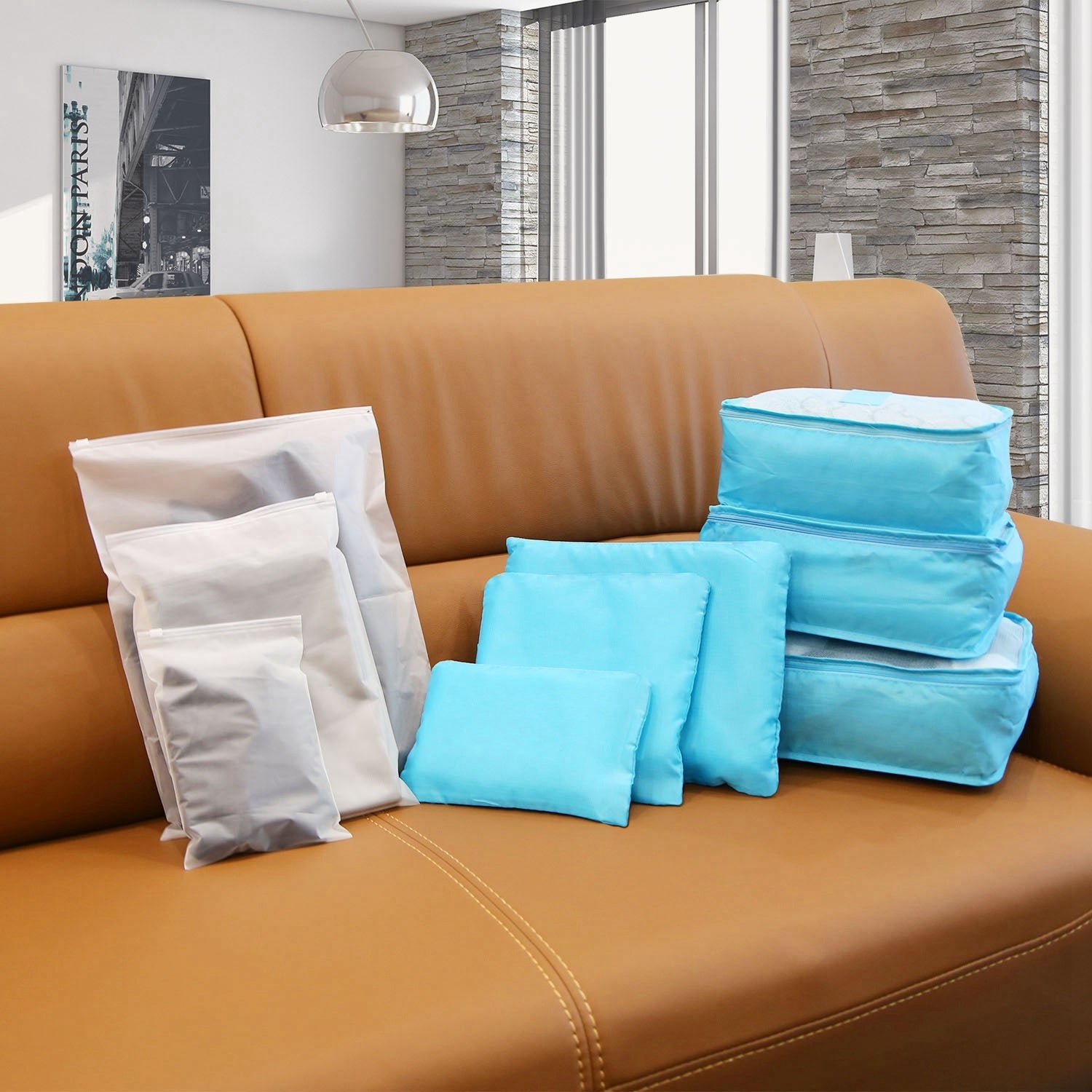 Water-resistant packing cube set with blue cubes and one white storage bag, zippered.