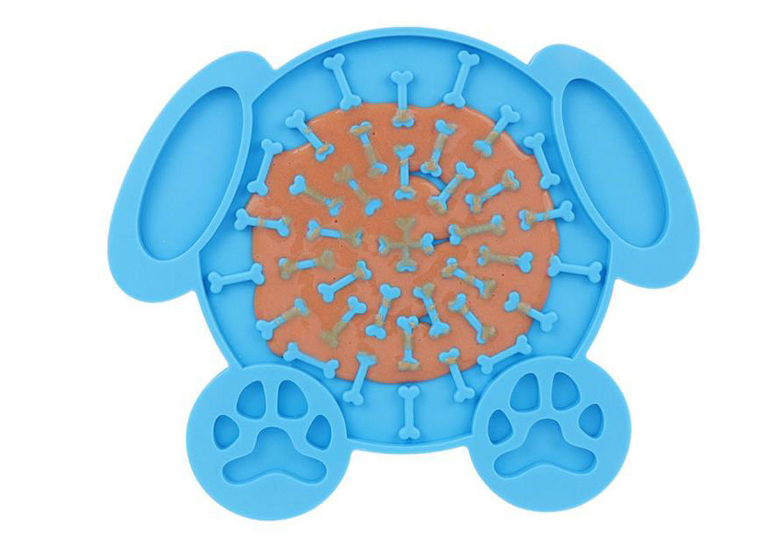 Blue dog lick mat with paw-print feet and bone-shaped ridge pattern filled center