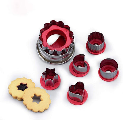 Red and stainless cookie cutter set with star and heart shaped pastry molds