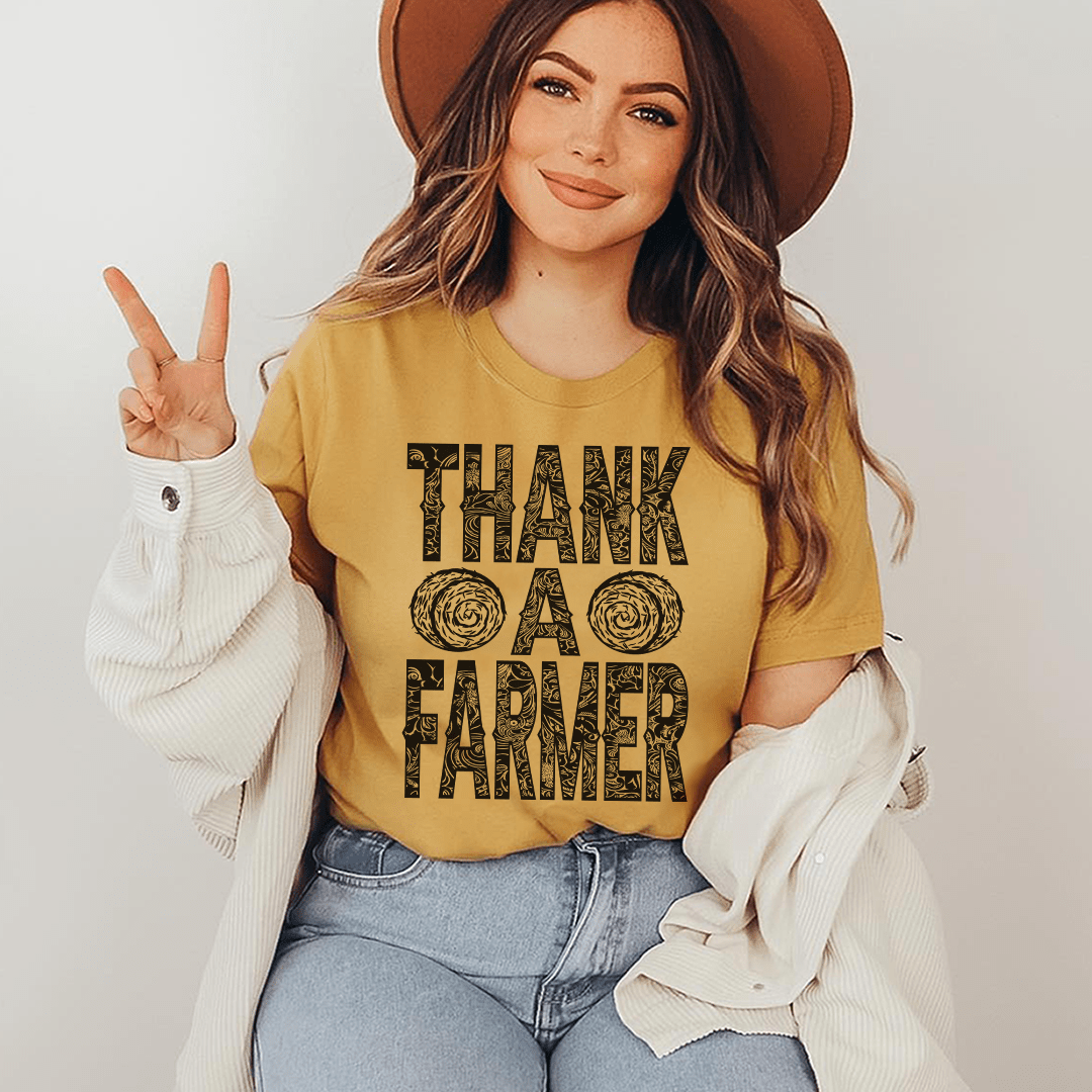 Mustard yellow thank-you farm t-shirt with 'THANK A FARMER' front graphic