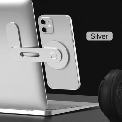 Silvery magnetic phone holder extension rack with circular mount and sliding arm.