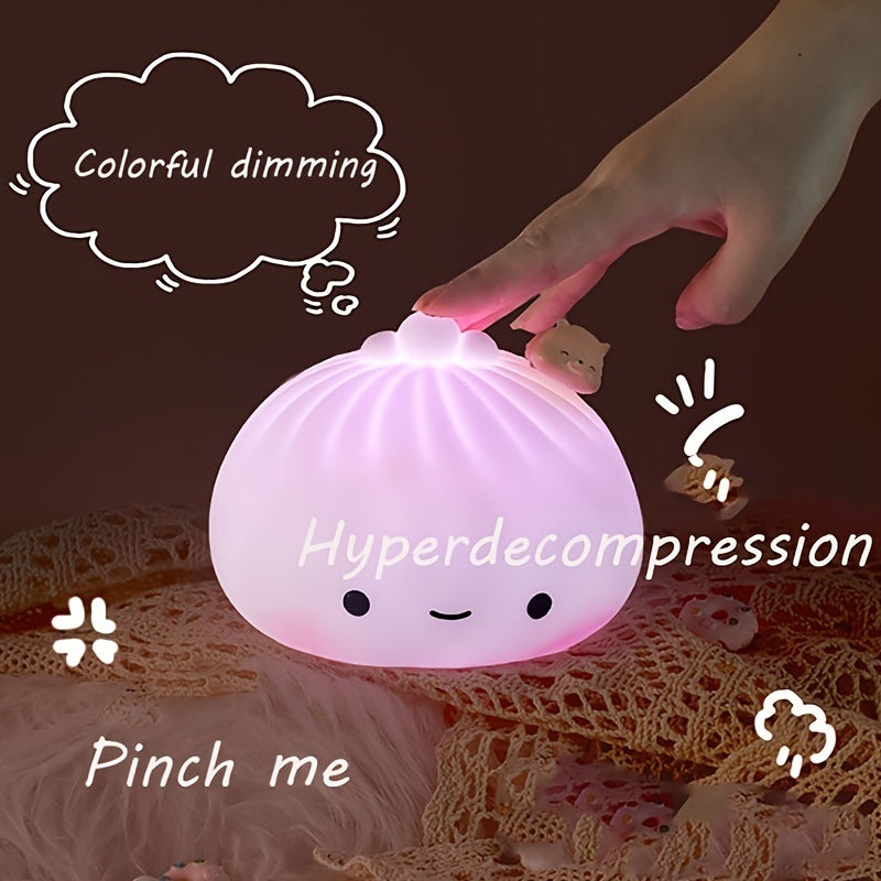 Purple glowing silicone dumpling night light with closed-eye face and pig charm on top