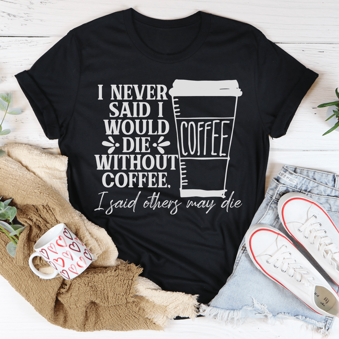Black crew-neck short-sleeve T-shirt with centered coffee cup quote graphic on front.