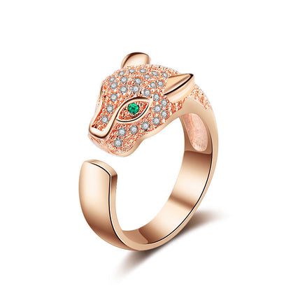Rose-gold open fox ring with green center stone and clear pavé stones