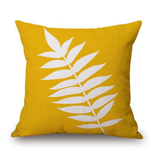 Mustard yellow leaf cushion cover with white layered leaf design.