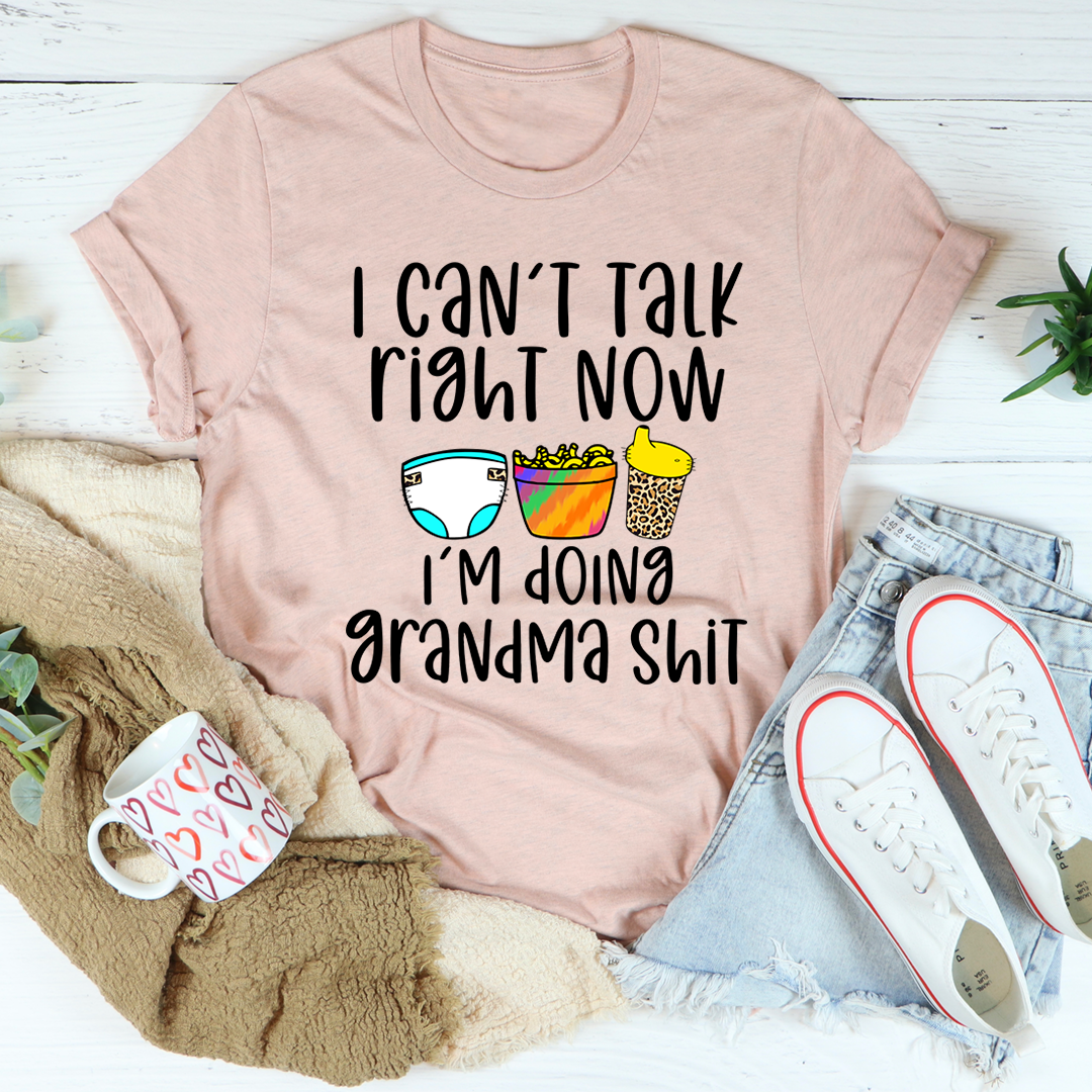Mauve short-sleeve T-shirt with front graphic text and colorful sunglasses, cup, and mug icons