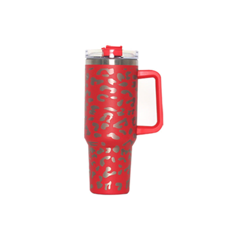 Vacuum tumbler with red leopard pattern, red handle, and clear straw lid