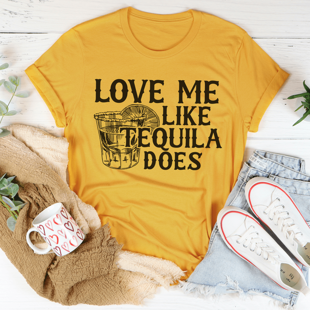 Gold crew-neck T-shirt with front graphic text "Love Me Like Tequila Does"