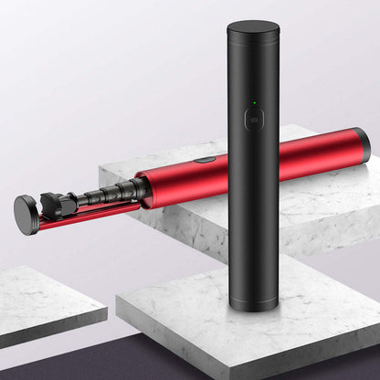 Black mini selfie stick with red extendable arm and phone mount, angled across steps.