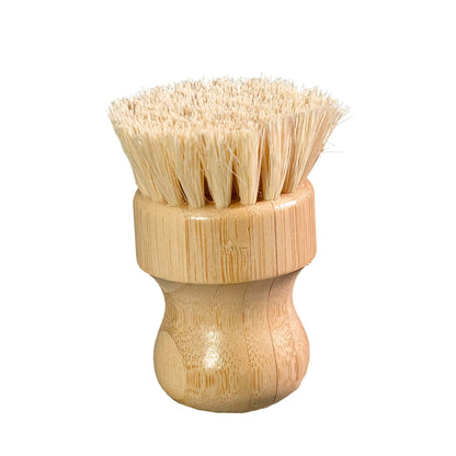 Wood-handled bristle cleaning brush for scrubbing kitchen cookware.