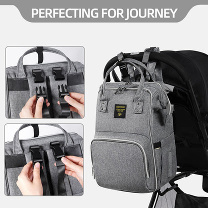 Gray diaper bag backpack with front pockets, organizer panel, and padded shoulder straps