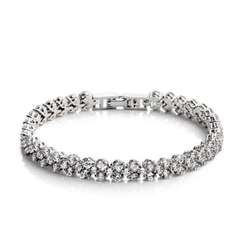 Silver tennis bracelet with round rhinestone stones and box clasp