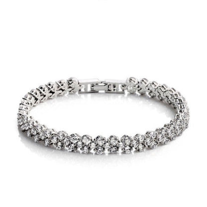 Silver tennis bracelet with round rhinestone stones and box clasp