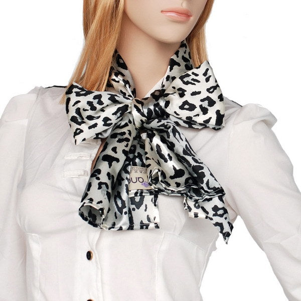 Leopard print silk scarf bow at the neck with trailing ends