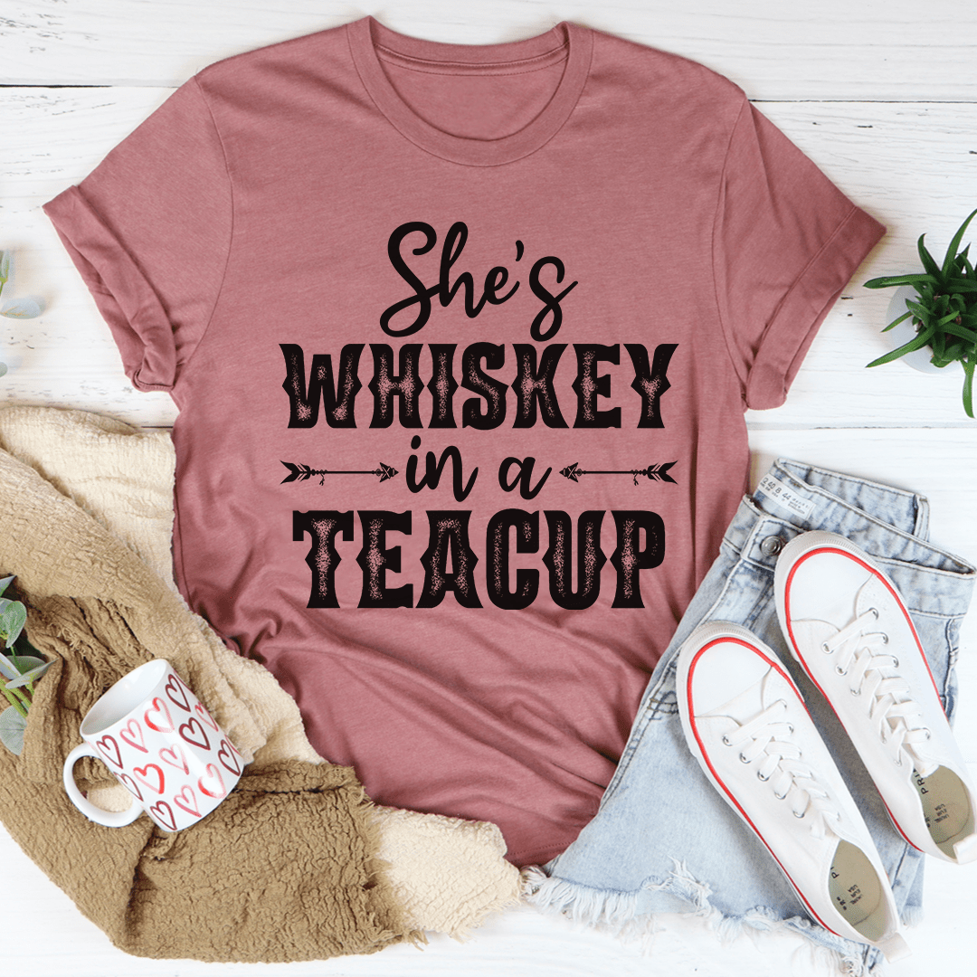 Mauve rose T-shirt with “She’s Whiskey in a Teacup” graphic on the front